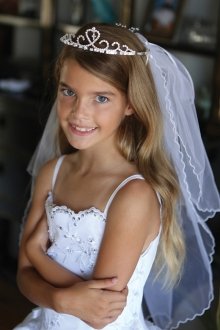 Beautiful tiara with a dangling cross attached to double layer veil