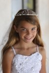 Dainty tiara with a dangling cross attached to embroidered veil