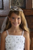 Gorgeous rhinestone tiara with a dangling cross attached to double layer veil