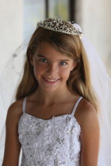 Pretty rhinestone tiara with a dangling cross attached to veil