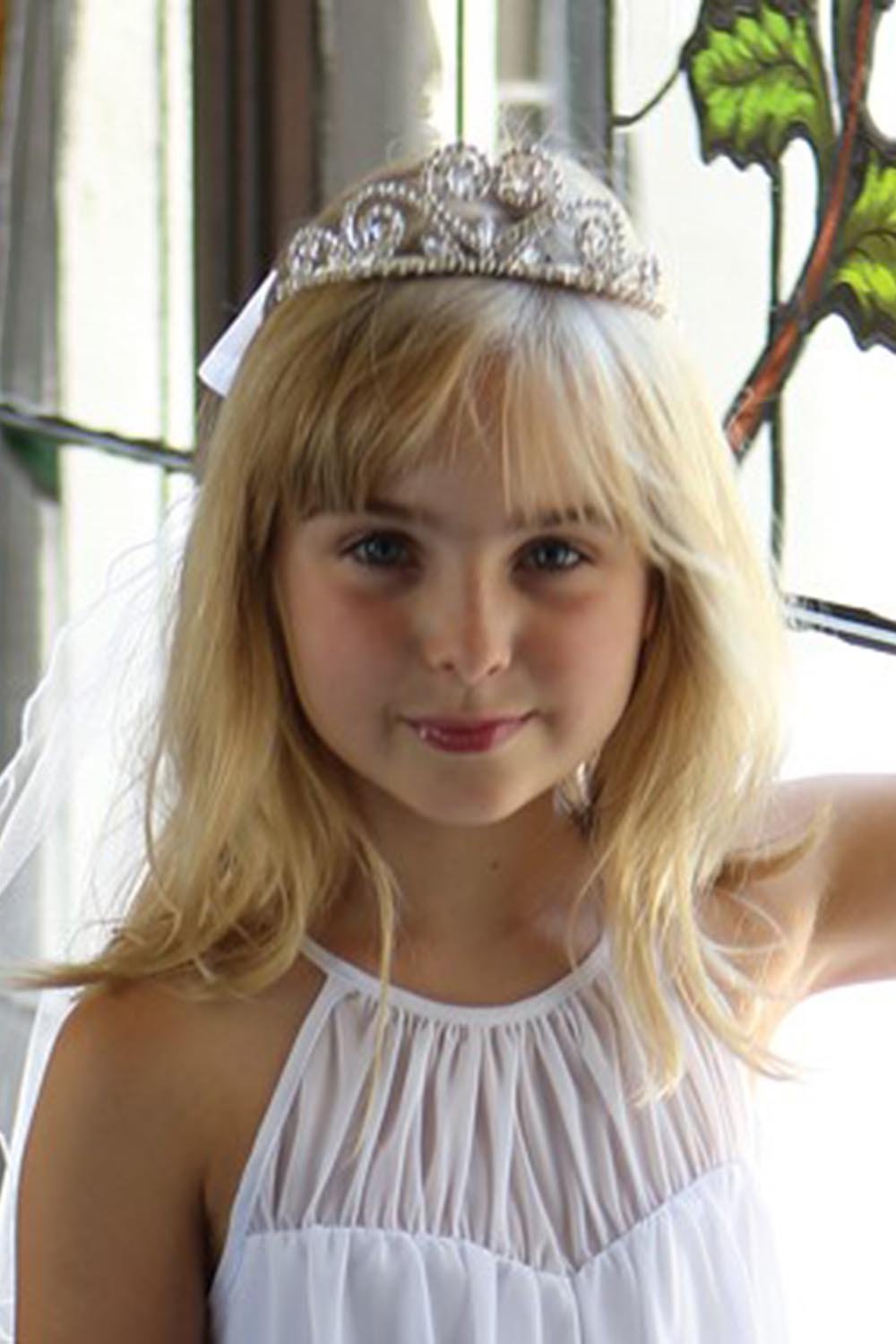 Stunning tiara with crystal beads & organza bow on back. Stunning tiara with crystal beads & organza bow on back.